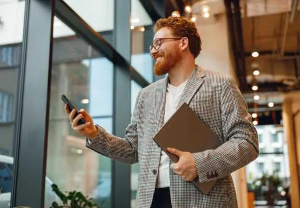 Handsome businessman manager with laptop